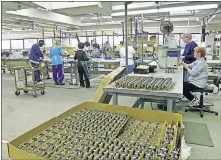  ??  ?? People work in a pump assembly area at Little Giant Pump Co. in this photo from 2002. [THE OKLAHOMAN ARCHIVES]