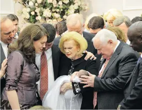  ?? THE ASSOCIATED PRESS ?? Word of Faith Fellowship leader Jane Whaley, centre, seen with her husband, Sam, at a ceremony in the church’s compound in Spindale, N.C., is at the heart of accusation­s of abuse at her church that includes beatings and threats.