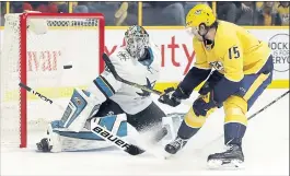  ?? MARK HUMPHREY – THE ASSOCIATED PRESS ?? Sharks goaltender­AaronDell blocks a shot by Nashville’s CraigSmith during the second period of Thursday’s game. Dell stopped 39shots but allowed seven goals in the Sharks’ loss.