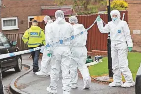  ?? ?? > Police forensic officers at Elliott Drive in Felling yesterday