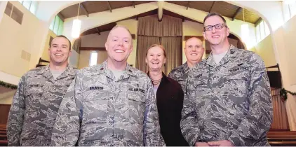  ?? GREG SORBER/JOURNAL ?? The chaplaincy staff at Kirtland Air Force Base, from left, the Rev. Matthew Ritchie, the Rev. Gregory Brunson, volunteer Marykay Chapman, the Rev. Thomas Elbert and the Rev. Davie Dziolek, in the base chapel.