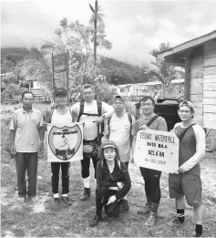  ??  ?? A group photo with the head of a village, Data Bila, before heading for the Tekiwit Waterfall.