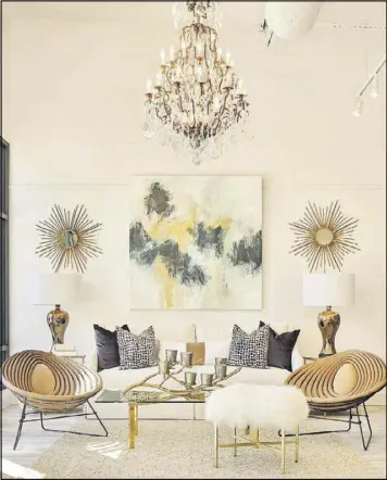  ?? CONTRIBUTE­D BY EMILY FOLLOWILL ?? The vignette captures the spirit and design aesthetic of Huff Harrington Home: A neutral backdrop that comes to life with a little sparkle from the antique French chandelier, a bold abstract painting by Melissa Payne Baker and matching starburst...