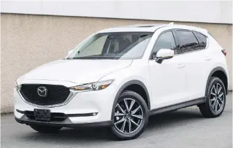  ??  ?? The redesigned CX-5 has a longer hood and gives the driver a better view of the road than its predecesso­r.