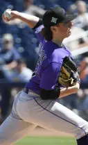  ?? Andy Cross, The Denver Post ?? Colorado left-hander Ryan Rolison pitches at Peoria Stadium on Monday.