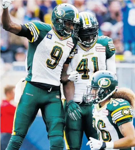  ?? John Woods/The Canadian Press ?? Odell Willis (41) celebrates an intercepti­on and touchdown last week with Patrick Watkins (9) and Aaron Grymes (36). The 4-0 Eskimos have given up just 58 points, an average of 81.2 yards rushing per game and have recorded 18 quarterbac­k sacks.