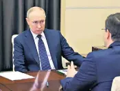  ?? ?? Vladimir Putin talks with Gleb Nikitin, the governor of the Nizhny Novgorod region, during their meeting at the Novo-ogaryovo residence