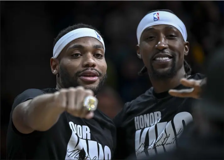  ?? AARON ONTIVEROZ — THE DENVER POST ?? Bruce Brown of the Indiana Pacers, left, flashes his championsh­ip ring as he stands beside former Nuggets teammate Kentavious Caldwell-pope before a Jan. 14game at Ball Arena.