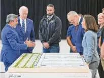  ?? Mandel NGAN/AFP via Getty Images ?? President Joe Biden joins Senate Majority Leader Chuck Schumer, Gov. Kathy Hochul and others at Onondaga County Community College in Syracuse on Oct. 27, 2022, to review plans for a Micron factory in central New York.