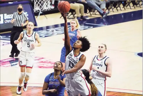  ?? David Butler II / Associated Press ?? UConn’s Christyn Williams (13) scores against DePaul during the first half on Tuesday in Storrs.