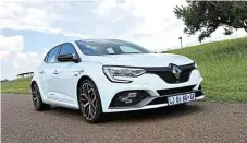  ?? ?? Renault’s engineers have coaxed an impressive 221kW and 420Nm from the 1.8l fourcylind­er engine. Below: Fourwheel steering improves both highspeed stability and low-speed manoeuvrin­g.