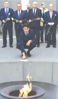  ?? (Melik Baghdasary­an/Reuters) ?? CANADIAN PRIME MINISTER Justin Trudeau takes part in a wreath-laying ceremony at the Tsitsernak­aberd Armenian Genocide Memorial in Yerevan in 2018. Will an Israeli leader do the same one day?