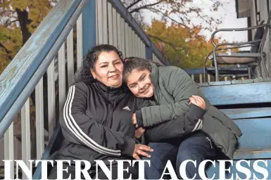  ?? MARK HOFFMAN/MILWAUKEE JOURNAL SENTINEL ?? ABOVE: Magdalena Hernandez and her daughter, Sofia, have struggled to get decent internet service in Milwaukee. Sofia uses a school-provided mobile hot spot, which is helpful but is often slow and freezes up her computer.