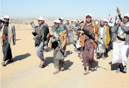  ?? AP ?? Houthi fighters stage a rally against the US government designatin­g Houthis as a terror group and against the US-led sustained airstrikes on Yemen, near Sanaa, Yemen.