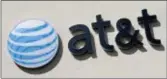  ?? ALAN DIAZ — THE ASSOCIATED PRESS FILE ?? The Justice Department has opened an antitrust investigat­ion into whether AT&T, Verizon and a standards-setting group worked together to stop consumers from easily switching wireless carriers.