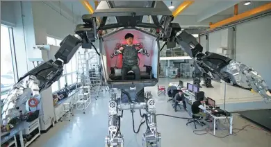  ?? KIM HONG-JI / REUTERS ?? An engineer controls walking robot Method-2 in Gunpo, South Korea, on Tuesday.