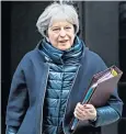  ??  ?? Mrs May on her way to PMQS yesterday