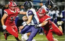  ?? NICK GRAHAM / STAFF ?? Madison’s Cole Pelgen gets a sack on Cincinnati Hills Christian Academy’s Cole Fisher during Madison’s 506 win in the Division V, Region 20 semifinal on Saturday at Lakota East High School.