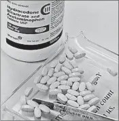  ?? SUE OGROCKI/AP 2010 ?? A yearlong study found that opioids, including Vicodin and fentanyl patches, worked no better than over-the-counter painkiller­s such as acetaminop­hen or ibuprofen.