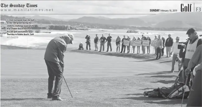  ??  ?? Clint Eastwood chips the ball to the 18th green during the celebrity challenge event of the AT&amp;T Pebble Beach National Pro-Am golf tournament on Thursday in Pebble Beach, Calif.