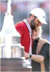  ?? PHOTO BY BRENNAN ASPLEN/AFP ?? NUMBER ONE Scottie Scheffler of the United States hugs Amy Saunders, daughter of Arnold Palmer, after winning the Arnold Palmer Invitation­al at Arnold Palmer Bay Hill Golf Course on Sunday, March 10, 2024, in Orlando, Florida.