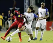  ?? ASSOCIATED PRESS ?? PANAMA’S ARMANDO COOPER (LEFT) FIGHTS FOR the ball with United States’ Jermaine Jones (center) as teammate Darlington Nagbe looks on during Tuesday’s game in Panama City.