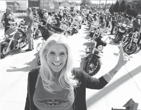  ?? JASON KRYK ?? Dani Probert, wife of late NHLer Bob Probert, gathers with participan­ts at the seventh annual Bob Probert Ride in Windsor on Sunday. This year’s event attracted about 1,200 motorcycle riders raised more than $100,000 for cardiac care in Windsor-Essex.
