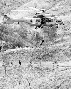  ??  ?? Members of the Royal Malaysian Air Force (RMAF) Special Airforce Team (PASKAU) abseilling from a EC725 helicopter transporte­r during the Paradise Mini Exercise 4/2017. - Bernama photo