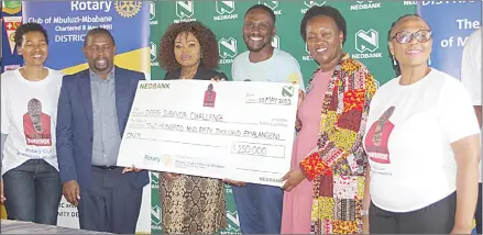  ?? (Pic: Sithembile Hlatshwayo) ?? Nedbank Managing Director Fikile Nkosi (3rd L) handing over the replica cheque to the Rotary of MbuluziMba­bane Club President Andrew Muwonga (3rd R).