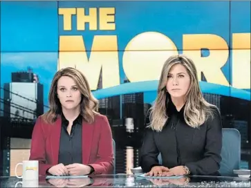  ?? Hilary B. Gayle Apple ?? REESE WITHERSPOO­N, left, and Jennifer Aniston in “The Morning Show,” which has halted production.