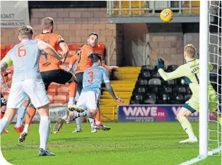  ??  ?? Dundee United’s Nicky Clark watches his header fly into the net