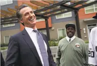  ?? Justin Sullivan / Getty Images ?? Lt. Gov. Gavin Newsom, who is running for governor, visits the Alice Griffith Apartments in S.F. last week.