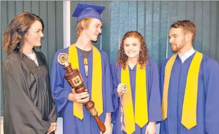  ?? ERIC MCCARTHY/JOURNAL PIONEER ?? School principal Heidi Morgan looks on as Westisle Class of 2018 Governor General’s medal-winner, Brianna Rayner is congratula­ted by Student Council president Griffen Arsenault, second left, and valedictor­ian Chandler Gard.