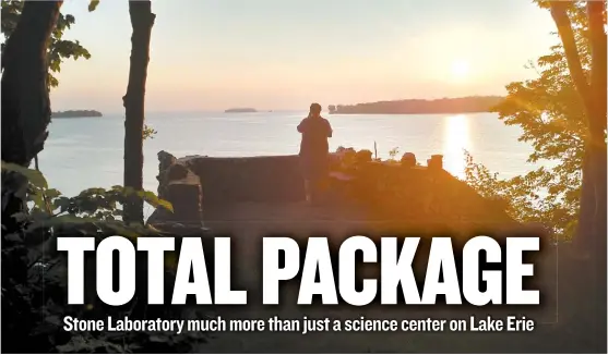  ??  ?? Stone Laboratory is both a place of serious research, with interim director Chris Winslow ( right) demonstrat­ing various water samples and holding a yellow perch from a bottom trawl, and a place of beauty on Gibraltar Island on Lake Erie. The island...