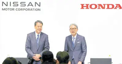  ?? AP ?? Nissan Chief Executive Makoto Uchida, left, and Honda President Toshihiro Mibe attend a joint news conference in Tokyo, Friday, March 15, 2024.