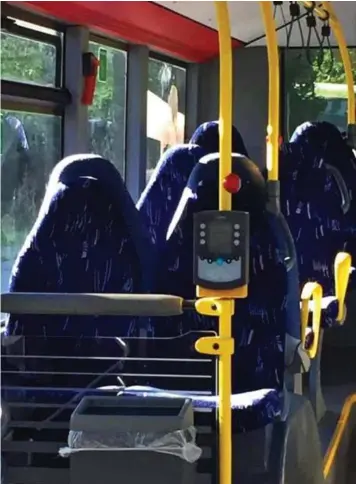  ??  ?? Just an illusion: The empty seats on this bus were mistaken for burka-clad women