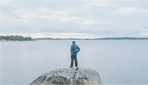  ?? KSENIA IVANOVA PHOTOS THE NEW YORK TIMES ?? Leo Gastgivar, a retiree living on an island in Finland’s Archipelag­o Sea, thinks the Russian military is setting up operations on a nearby island.