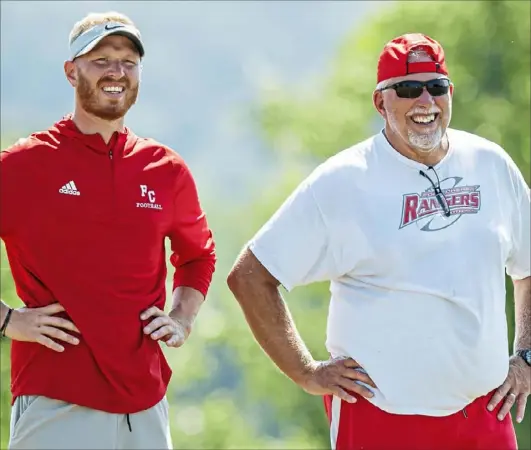  ?? Steph Chambers/Post-Gazette ?? Tanner Garry, left, is Fort Cherry's new football coach. One of his assistants is his father, Tim.