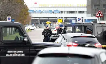  ??  ?? Dutch military police carry out controls at the entrance to Rotterdam Airport in Rotterdam. — AFP photo