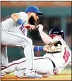  ??  ?? Atlanta Braves’ Brian McCann (16) advances to second base on a wild pitch as New York Mets shortstop Amed Rosario handles the late throw during the fifth inning of a baseball game on Aug 13 in
Atlanta. (AP)