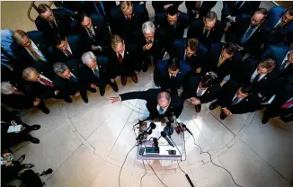  ?? ERIN SCHAFF / THE NEW YORK TIMES ?? Rep. Steve Scalise (center), R-La., and other House Republican­s speak outside the secure room Wednesday where impeachmen­t investigat­ion interviews are taking place. The group delayed a Defense Department official’s deposition for hours after storming the room and refusing to leave.