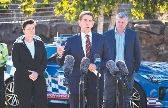  ?? ?? Queensland Treasurer Cameron Dick, joined by Police Minister Mark Ryan (right), and MP Melissa Mcmahon, speaks during a press conference regarding police camera trailers designed for targeting hooning behaviour. Picture: Dan Peled / NCA Newswire