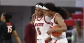  ?? ETHAN HYMAN - THE ASSOCIATED PRESS ?? North Carolina State’s Kayla Jones (25), right and Jada Boyd (5) walk off the court after an NCAA college basketball game against Virginia Tech, Sunday, Jan. 24, 2021 in Raleigh, N.C.