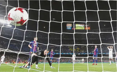  ?? — AP ?? Back of the net: Barcelona’s Paco Alcacer (second from left) scoring Barcelona’s first goal in their 5- 0 win over Real Murcia in the Spanish Cup on Wednesday.