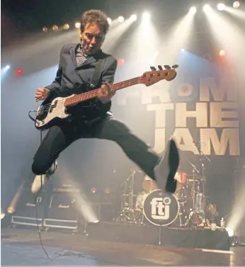  ?? ?? From The Jam’s Bruce Foxton gives his trademark scissor jump. Photo by Gary Clark.