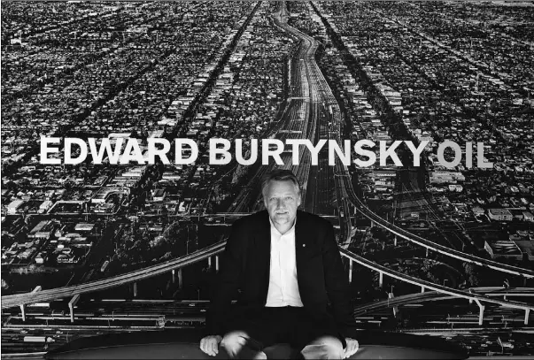  ?? Jason Franson, Postmedia News, file ?? Edward Burtynsky sits in front of one of his photograph­s.