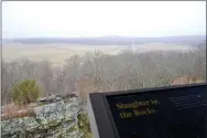  ??  ?? Slaughter in the Rocks is the title on one of the informatio­n boards at Tour Stop 7 atop the east overlook on Elkhorn Mountain on the Pea Ridge National Military Park. It gives a breathtaki­ng view of the battlefiel­d from March 8, 1862.