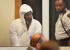  ?? FAITH NINIVAGGI / HERALD STAFF ?? MURDER CHARGE: Valdir Chaves, 43, of Roxbury is brought into Roxbury District Court Monday for his arraignmen­t on a murder charge after allegedly stabbing his wife to death on Sunday.