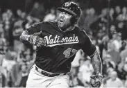  ?? Wally Skalij / TNS ?? Howie Kendrick lifted Washington to its first NLCS with a grand slam in Game 5 against the Dodgers.
