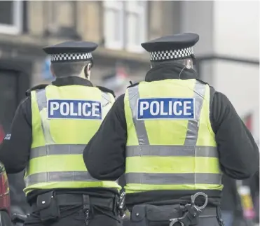  ?? ?? Police Scotland said it is reducing staff numbers ‘proportion­ately’ in line with officer numbers